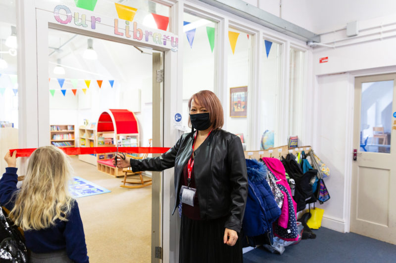 Kerry cutting the ribbon to open Avanti School library